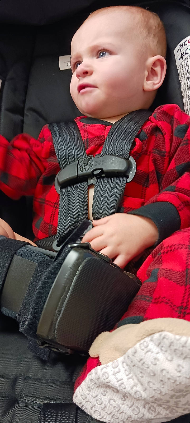 Aiden joined the competition — help win amazing prizes! baby, carmine, child, collar, comfort, eyewear, fashion_accessory, human_leg, outerwear, pattern, person, personal_protective_equipment, plaid, red, seat_belt, sitting, sleeve, tartan, textile, toddler