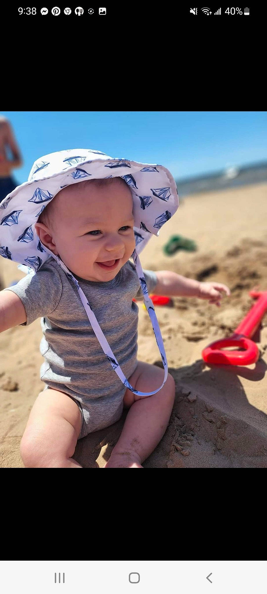 Cian is registered to the contest to win money with this photo: baby, baby_toddler_clothing, beach, cap, fun, happy, hat, headgear, headwear, landscape, leg, leisure, people_in_nature, people_on_beach, person, recreation, sand, sky, smile, sun_hat