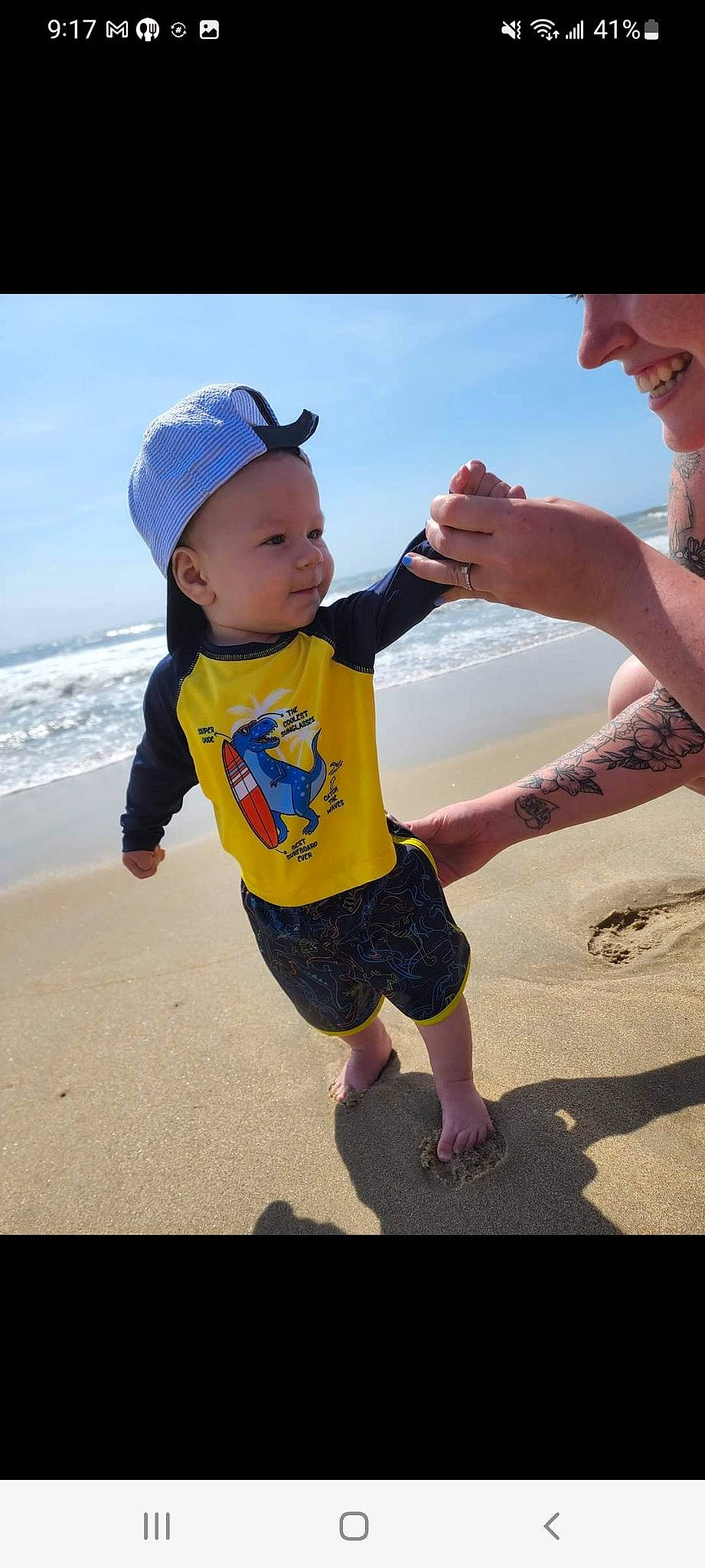 Cian joined the competition — help win amazing prizes! arm, beach, clothing, cloud, facial_expression, gesture, hand, happy, human, human_body, mammal, people_in_nature, people_on_beach, person, shorts, sky, sleeve, sunlight, t_shirt, vertebrate