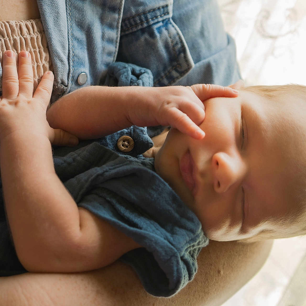 Finn joined the competition — help win amazing prizes! baby, sleeping, arm, hand, denim, clothing, person, portrait, closeup, skin, infant, newborn, soft_light, indoor, window, fabric, peaceful, cute, tiny_fingers, resting