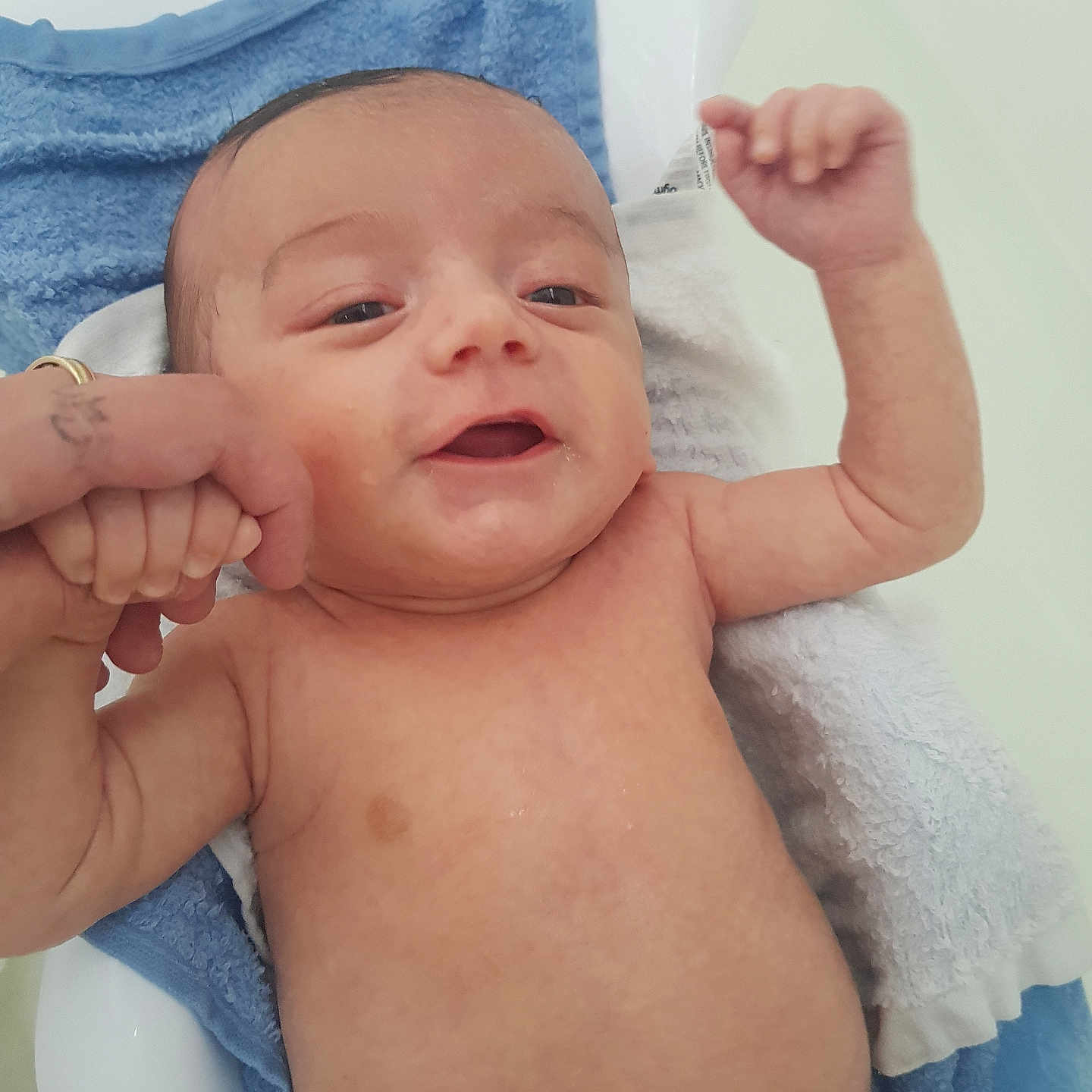 Karson-Lee is registered to the contest to win money with this photo: architecture, baby, bodypart, bonnet, building, clothing, diaper, face, finger, hand, hat, head, hospital, indoors, newborn, person, photography, portrait, towel, wrist