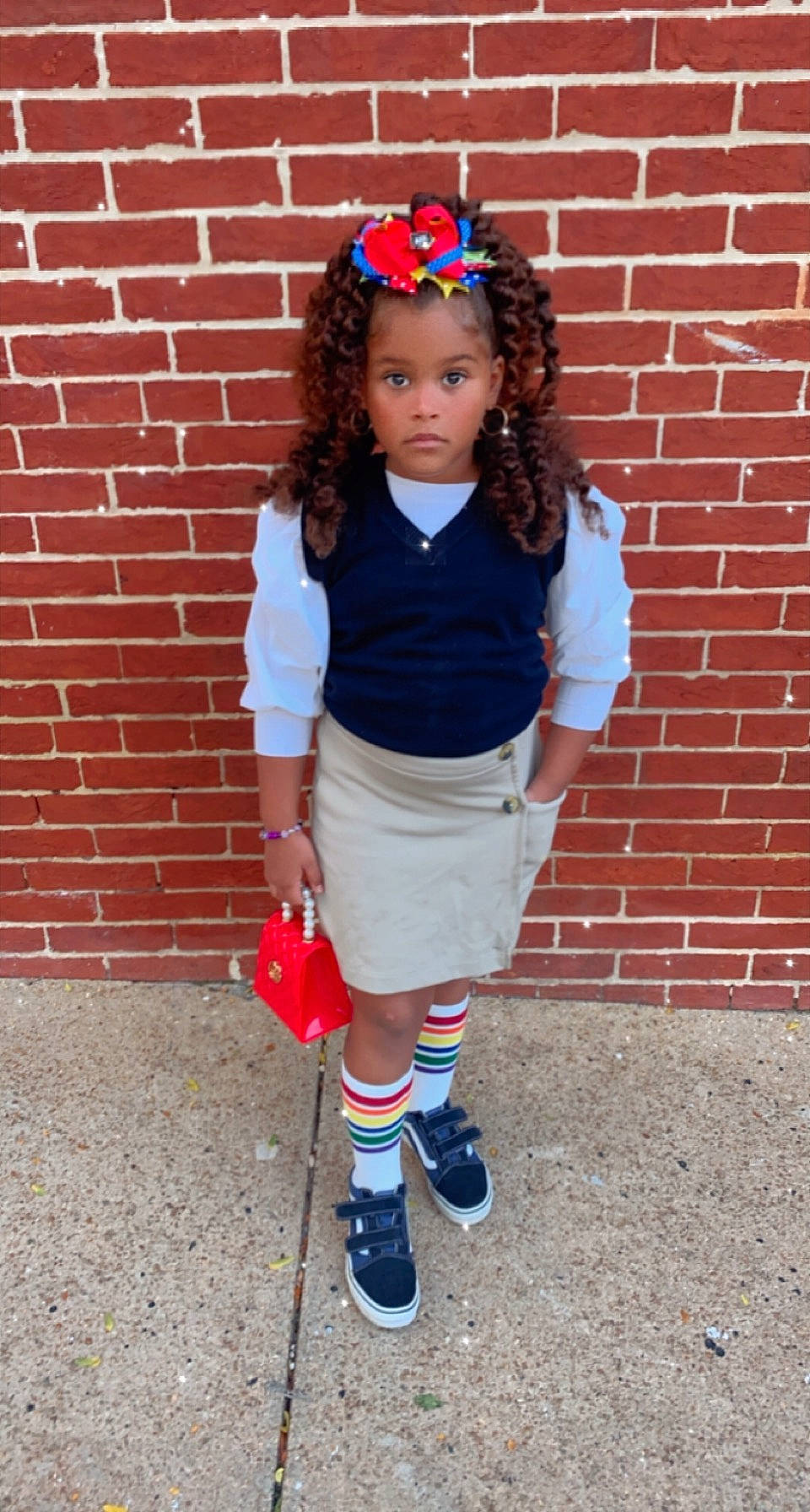 Royale is registered to the contest to win money with this photo: arm, brick, brickwork, cool, hair, hairstyle, knee, outerwear, person, pigtail, pink, plaid, school_uniform, shorts, sleeve, sock, street_fashion, t_shirt, tartan, thigh