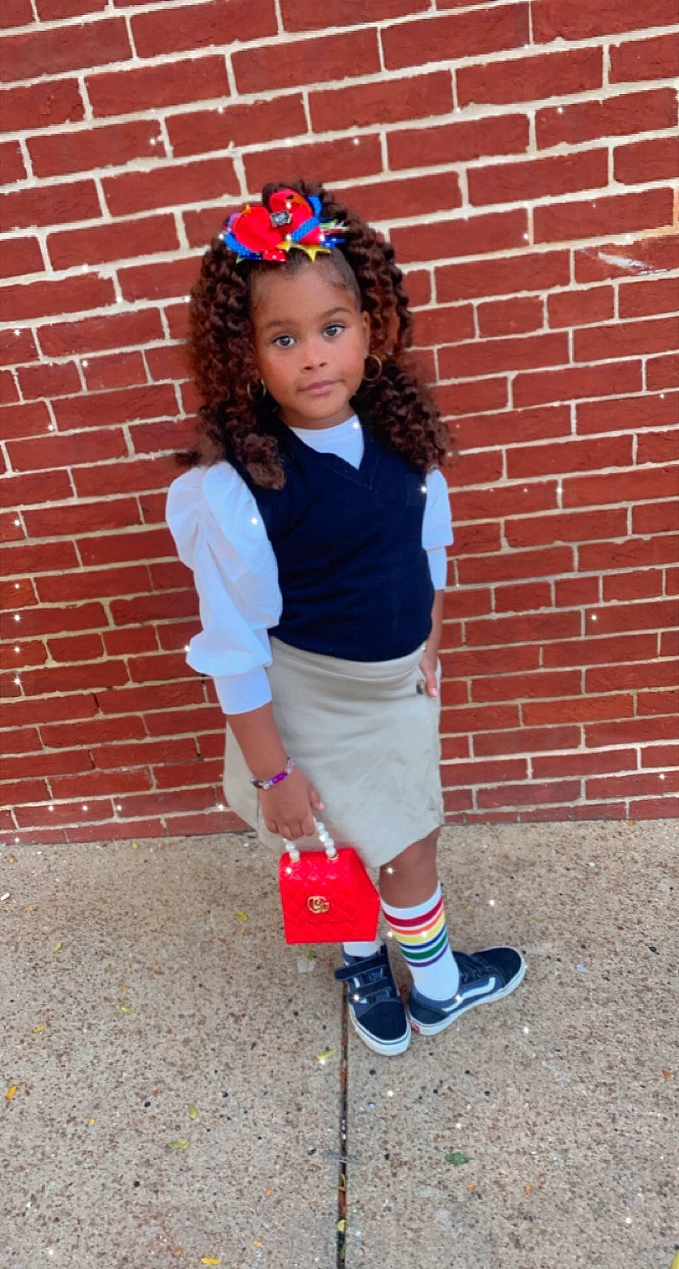 Royale is registered to the contest to win money with this photo: arm, brick, brickwork, face, hair, happy, head, knee, person, plaid, red, shorts, sleeve, sneakers, sock, sports_gear, sportswear, street_fashion, t_shirt, thigh