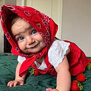 Serli joined the competition — help win amazing prizes! baby, child, face, blue_eyes, red_bandana, red_clothing, crawling, strawberries, green_surface, indoors, cute, smile, white_shirt, infant, headscarf, playful, portrait, close_up, person, happy