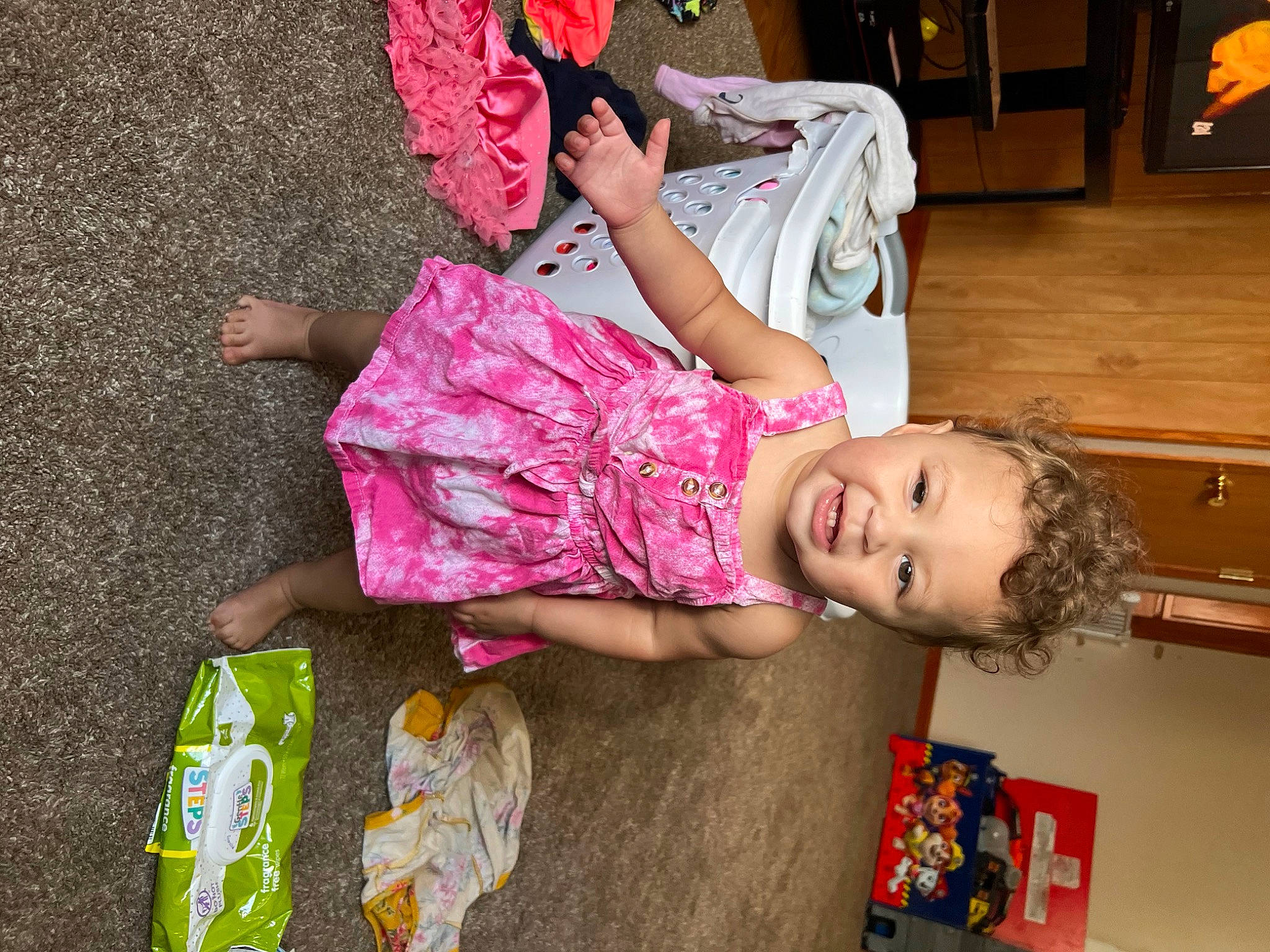 Kamora is registered to the contest to win money with this photo: baby_toddler_clothing, beauty, child, dress, flooring, fun, happy, houseplant, human, human_leg, leisure, magenta, pattern, person, pink, red, skin, smile, summer, thigh