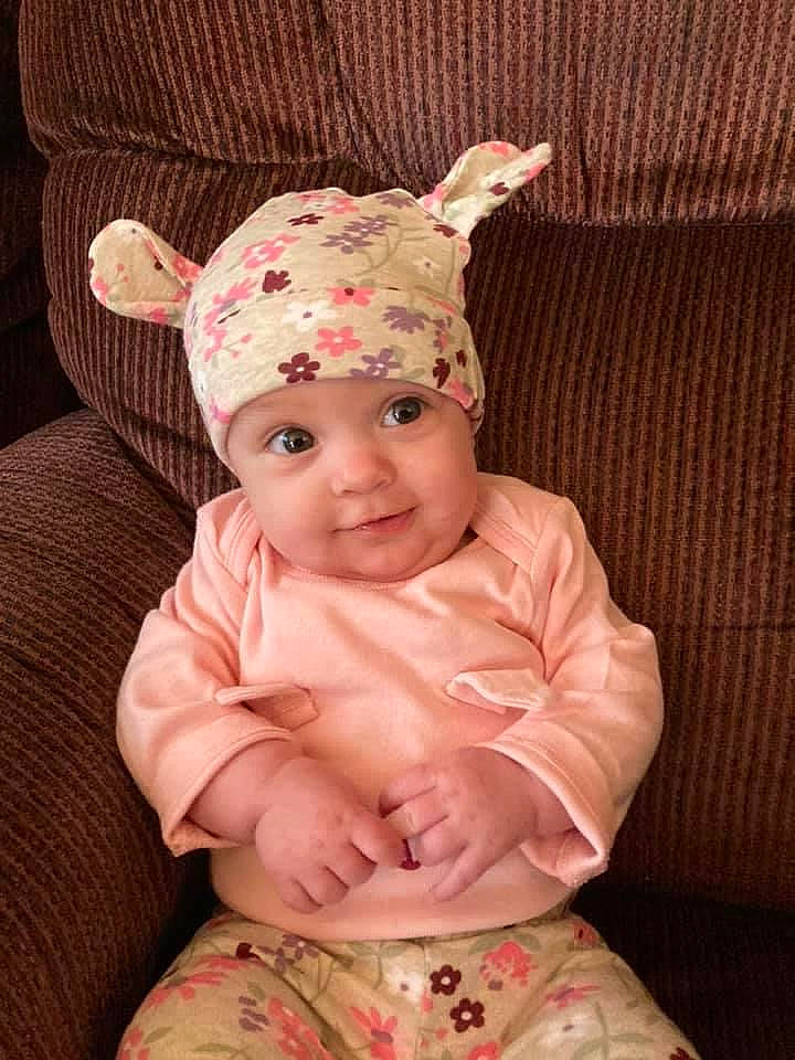 Laidan is registered to the contest to win money with this photo: baby, baby_toddler_clothing, cap, child, comfort, costume_hat, glasses, happy, head, headwear, human_body, knit_cap, lip, magenta, pattern, person, pink, skin, sleeve, smile