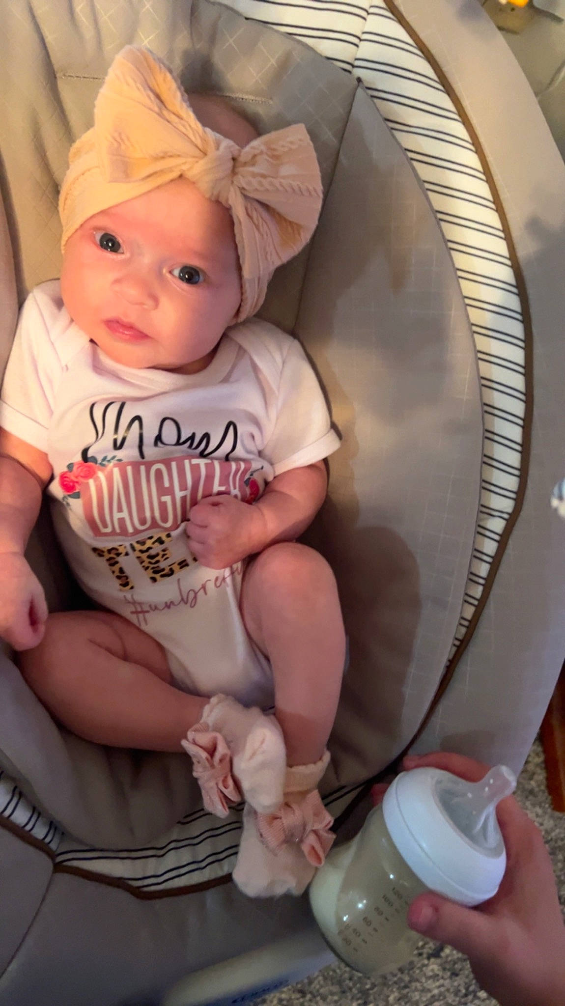 Keagan joined the competition — help win amazing prizes! baby, baby_products, baby_toddler_clothing, cheek, child, comfort, finger, hand, headwear, human_leg, leg, organ, person, pink, plastic_bottle, sitting, skin, sleeve, thigh, thumb