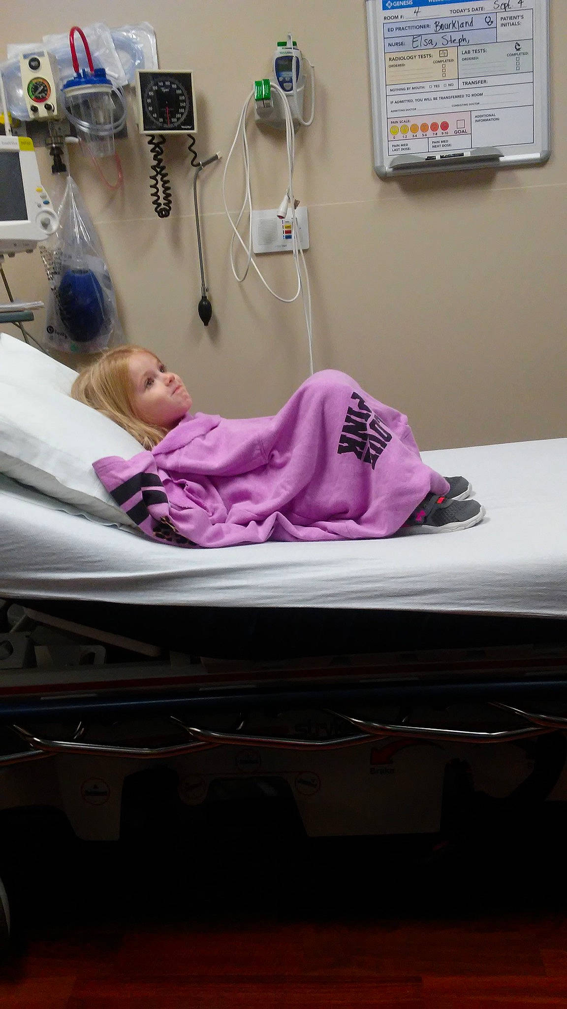 Kara is registered to the contest to win money with this photo: arm, bed, clinic, floor, flooring, furniture, girl, health_care, hospital, medical, medical_equipment, patient, person, product, purple, table