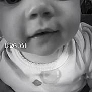 Magnolia is registered to the contest to win money with this photo: baby, close_up, black_and_white, infant, face, eyes, onesie, timestamp, portrait, child, cute, monochrome, small_child, smile, young, indoors, person, head, expression, looking