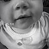 baby, close_up, black_and_white, infant, face, eyes, onesie, timestamp, portrait, child, cute, monochrome, small_child, smile, young, indoors, person, head, expression, looking