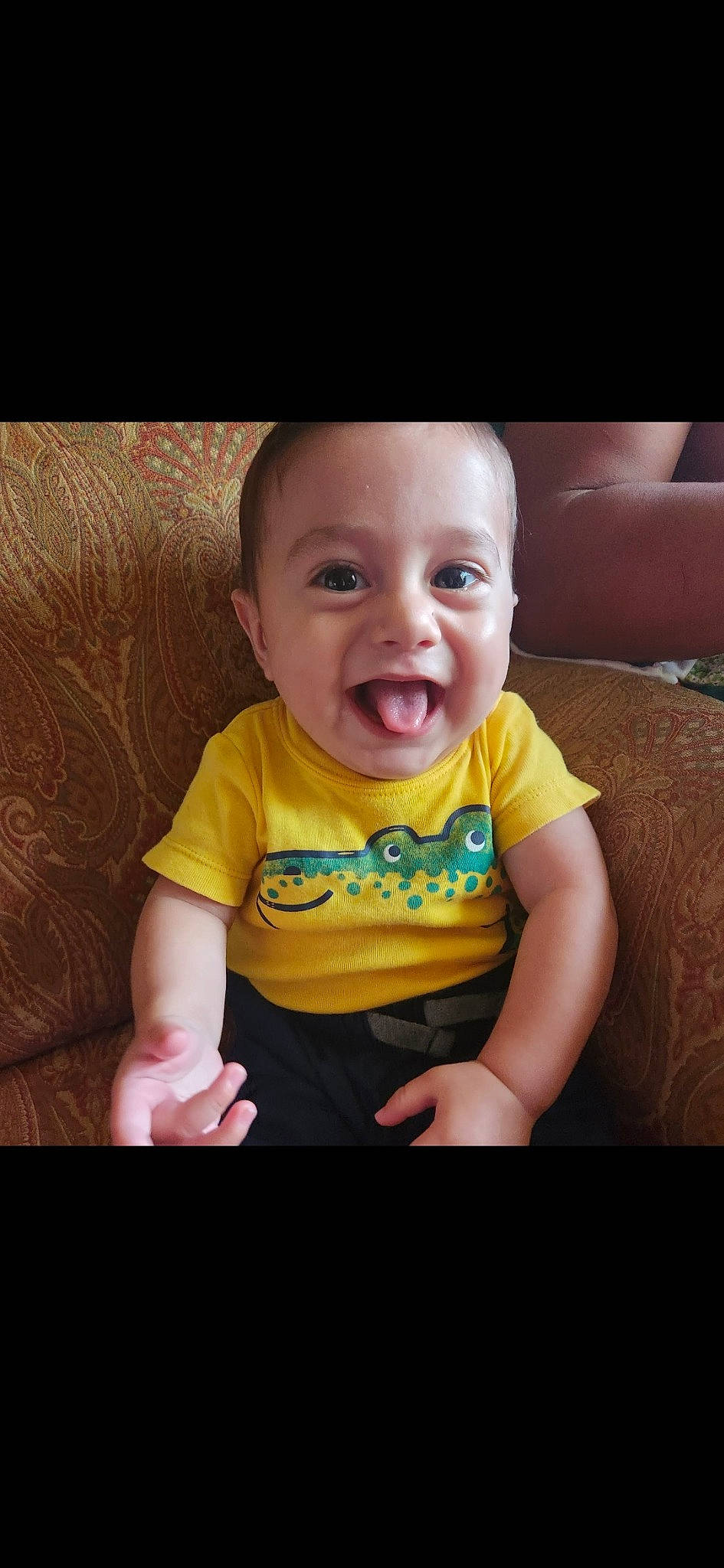 Enrique is registered to the contest to win money with this photo: arm, baby, baby_toddler_clothing, cheek, child, cool, eye, facial_expression, finger, flash_photography, fun, happy, iris, mouth, nose, person, skin, sleeve, smile, t_shirt