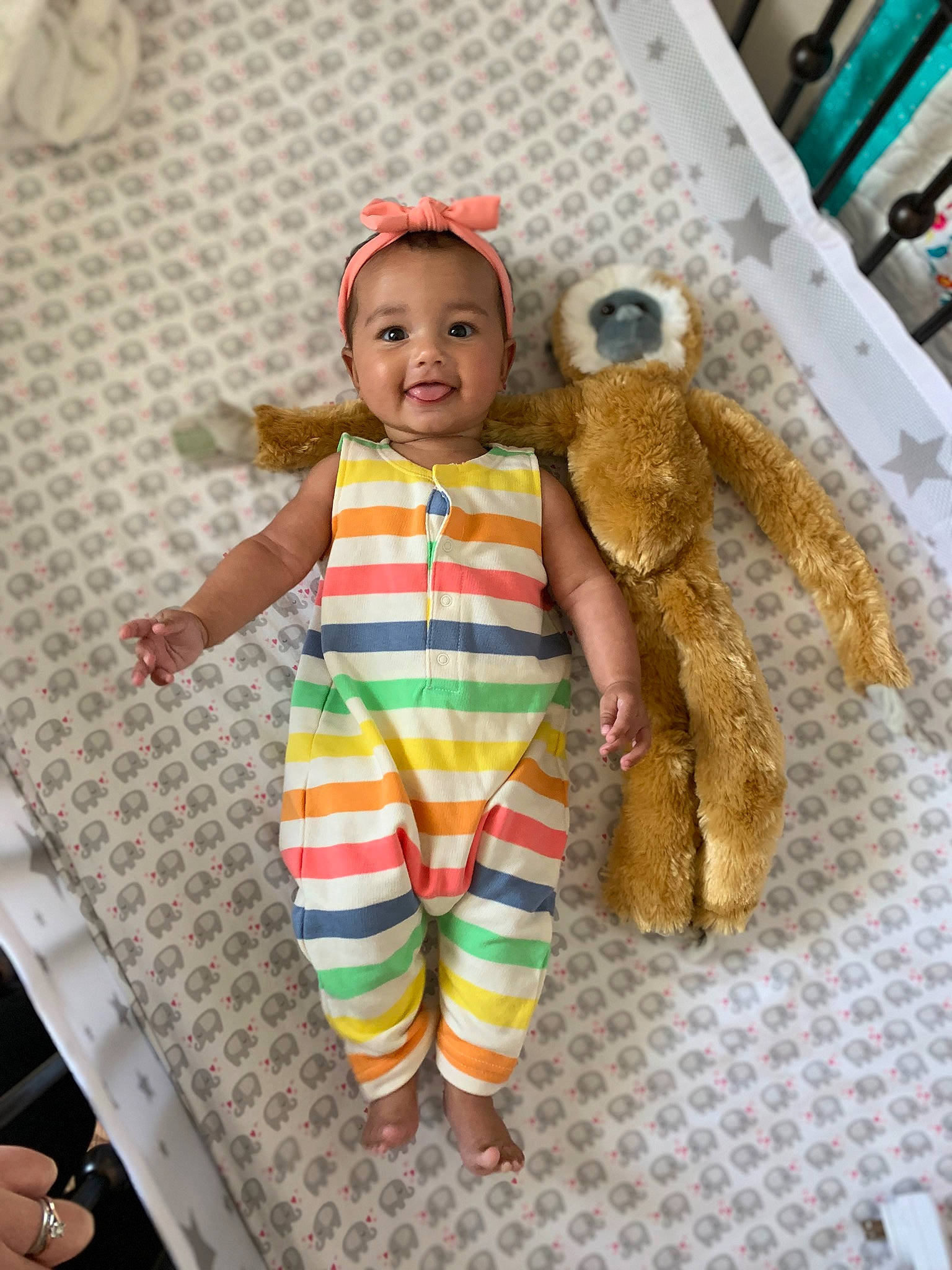 Emree is registered to the contest to win money with this photo: baby, baby_toddler_clothing, baby_toys, child, doll, eye, fashion_design, fawn, happy, joy, linens, pattern, person, plush, room, skin, sleeve, smile, stuffed_toy, textile