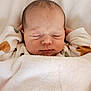 Louéna participe au concours pour gagner de l'argent avec cette photo : baby, newborn, sleeping, blanket, soft, cozy, infant, face, hands, closed_eyes, warm, cute, peaceful, indoors, child, rest, comfort, skin, head, clothing