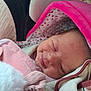 Louéna participe au concours pour gagner de l'argent avec cette photo : baby, newborn, smile, blanket, pink, hood, sleeping, soft, cozy, infant, face, child, wrapped, cute, warm, closeup, adorable, person, comfort, rest