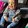 Kairo joined the competition — help win amazing prizes! baby, child, smiling, sitting, blue_clothing, jacket, toy, ball, sock, indoor, happy, face, portrait, young_child, cute, cozy, soft, focus, person, infant