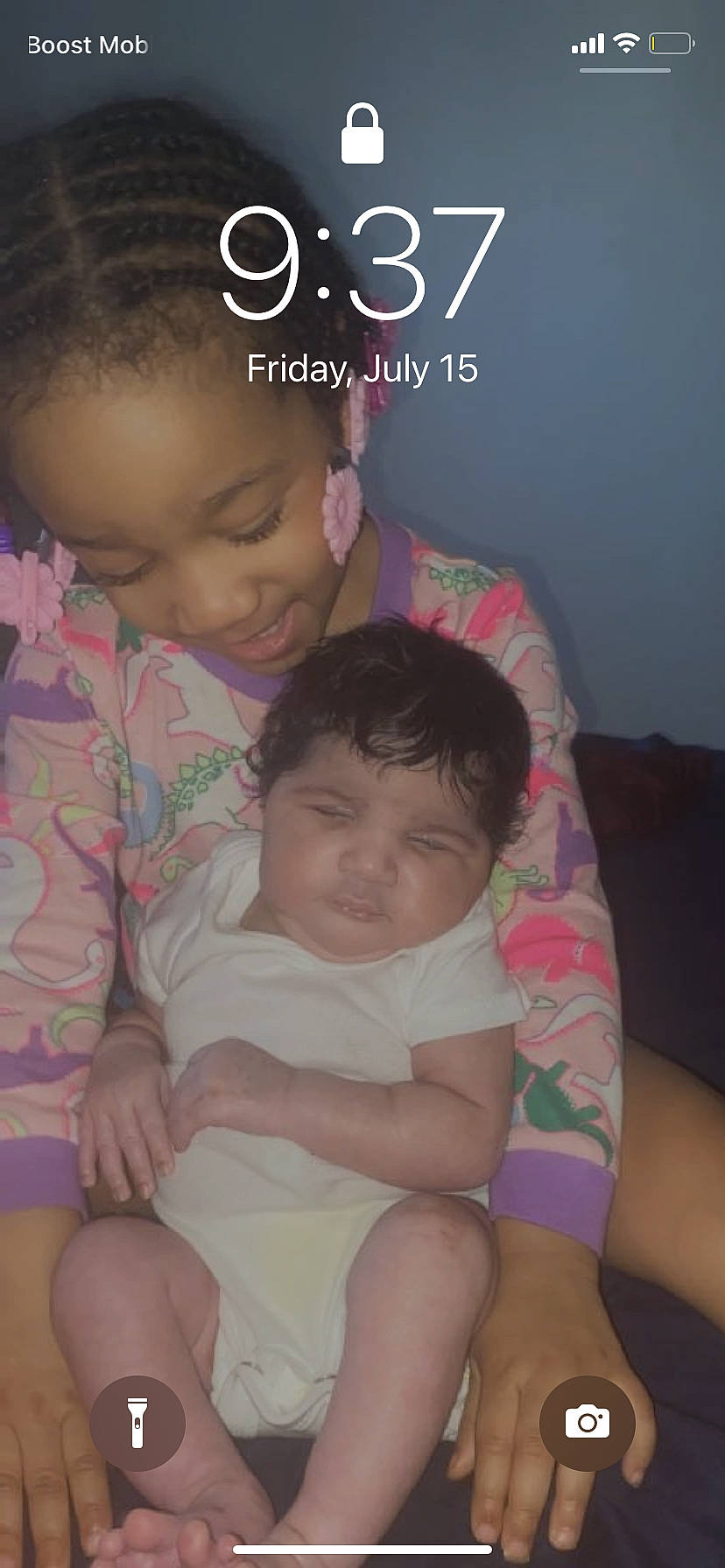 Amoura is registered to the contest to win money with this photo: arm, baby, cheek, chin, comfort, eye, eyebrow, face, finger, gesture, hair, hand, happy, head, iris, mouth, nose, organ, person, pink