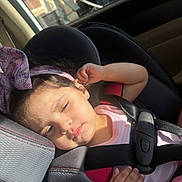 Elaina Amirah Beloua joined the competition — help win amazing prizes! toddler, child, car_seat, seatbelt, bow, headband, sleeping, sunlight, car_interior, seat, safety, relaxed, young_child, portrait, baby, clothing, resting, hand, pink, cute