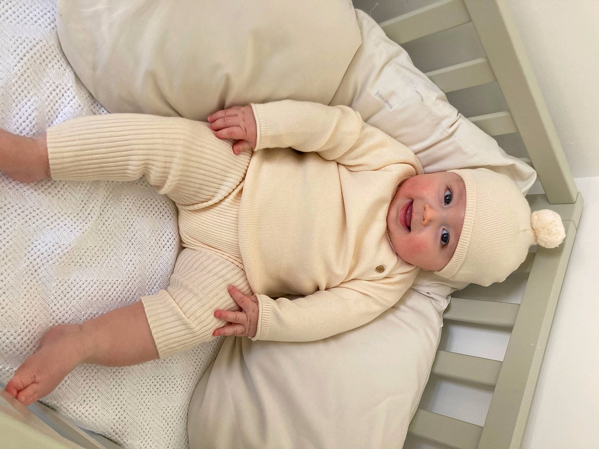 George joined the competition — help win amazing prizes! baby, baby_products, baby_sleeping, baby_toddler_clothing, child, collar, comfort, finger, gesture, glasses, headwear, human_body, knee, leg, linens, person, skin, sleeve, stomach, textile