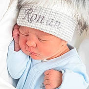Ronan-James joined the competition — help win amazing prizes! newborn, baby, sleeping, hat, pom_poms, blue_onesie, close_up, face, infant, cute, cozy, soft, blanket, peaceful, child, portrait, indoors, skin, resting, young