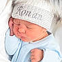 newborn, baby, sleeping, hat, pom_poms, blue_onesie, close_up, face, infant, cute, cozy, soft, blanket, peaceful, child, portrait, indoors, skin, resting, young