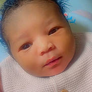 Sélénya participe au concours pour gagner de l'argent avec cette photo : baby, buttoned_clothing, calm, child, closeup, cozy, cute, eyes, face, hair, indoor, infant, knitted_sweater, looking, newborn, person, pink_clothing, portrait, skin, soft_light