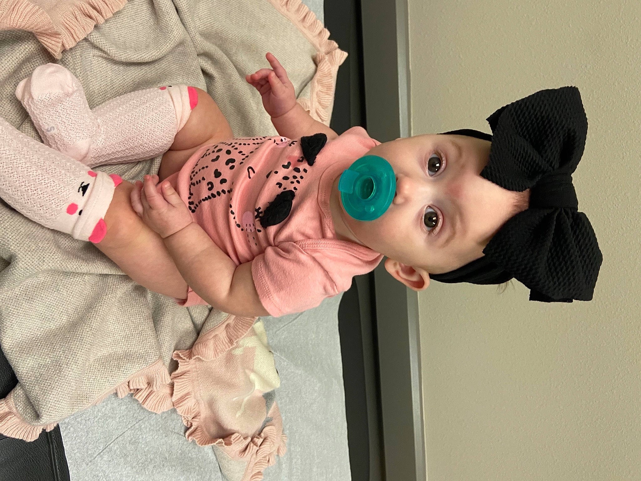 Mayzie is registered to the contest to win money with this photo: baby, baby_products, baby_toddler_clothing, cheek, child, comfort, eye, eyelash, happy, hat, headgear, lip, mouth, pattern, person, pink, skin, sleeve, surprise, toddler