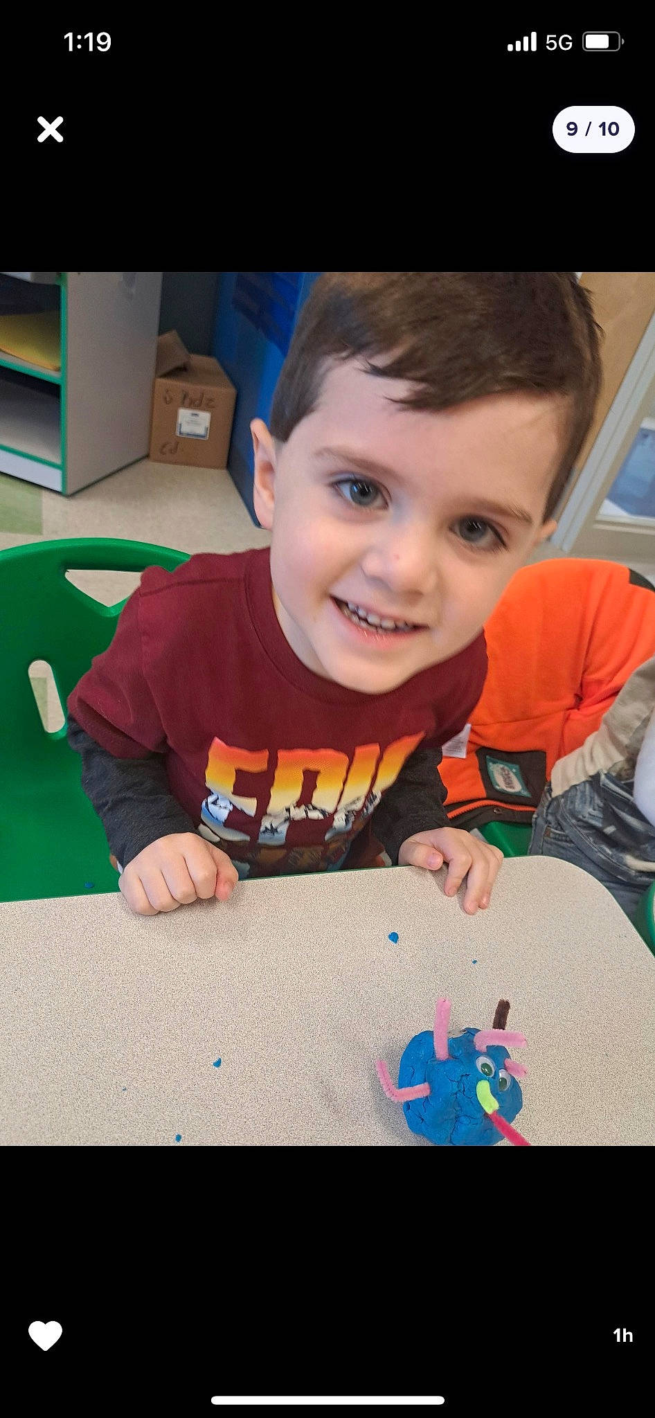 Brayden is registered to the contest to win money with this photo: art, baby, cheek, child, event, flooring, fun, games, happy, holiday, indoor_games_and_sports, joy, leisure, person, play, recreation, room, sitting, smile, t_shirt