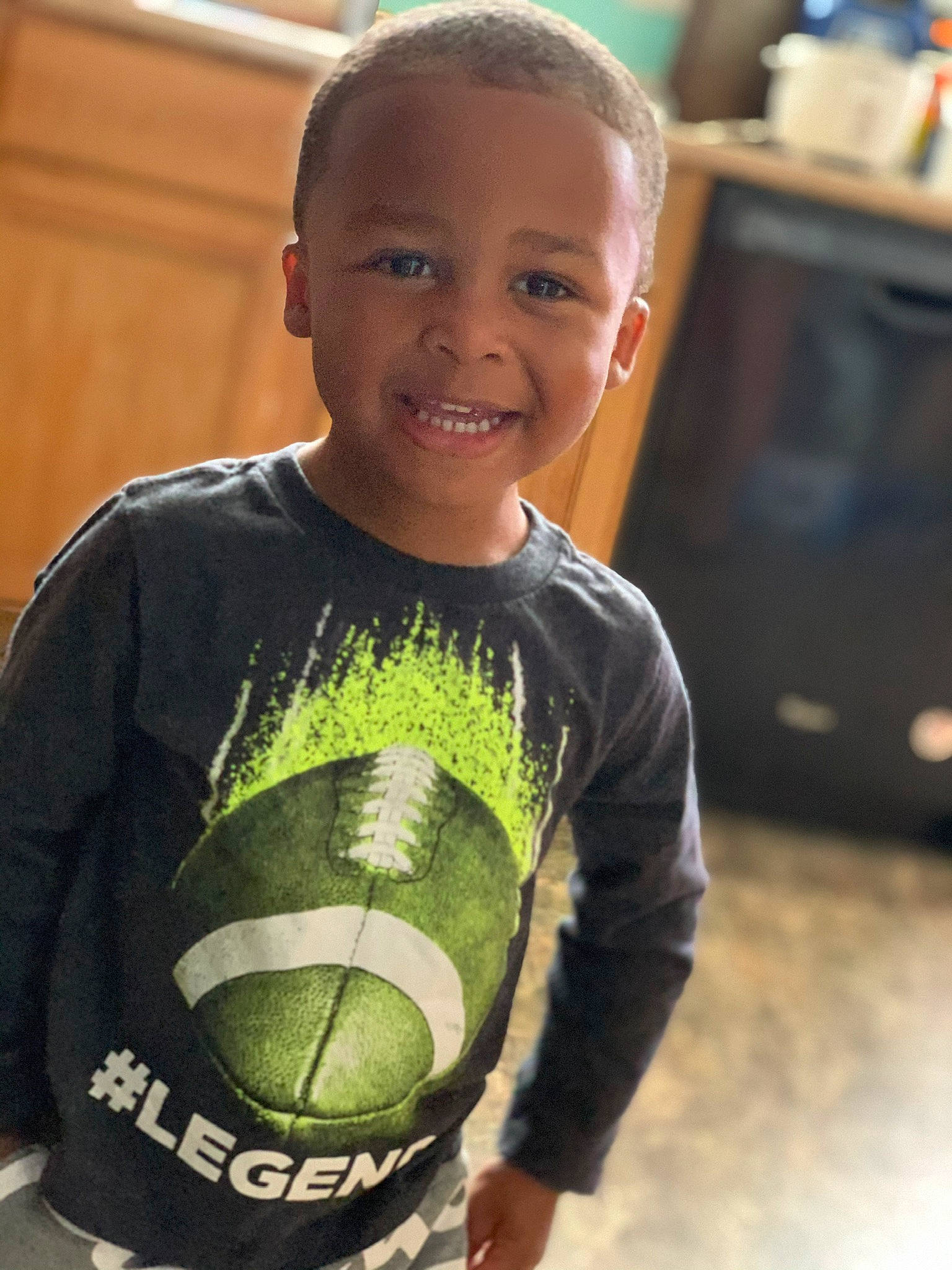 Amarion is registered to the contest to win money with this photo: ball, child, competition_event, cool, joy, person, personal_protective_equipment, player, smile, sportswear, t_shirt, toddler