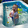 Paisley joined the competition — help win amazing prizes! toddler, child, pool, inflatable_pool, water, toys, backyard, wooden_fence, hose, blue_tarp, summer, play, dress, colorful, water_toys, happy, splash, outdoor, daytime, excitement