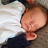 baby, blanket, child, clothing, cozy, cushion, cute, face, hair, hand, indoor, infant, nap, newborn, peaceful, portrait, resting, sleeping, soft, toddler
