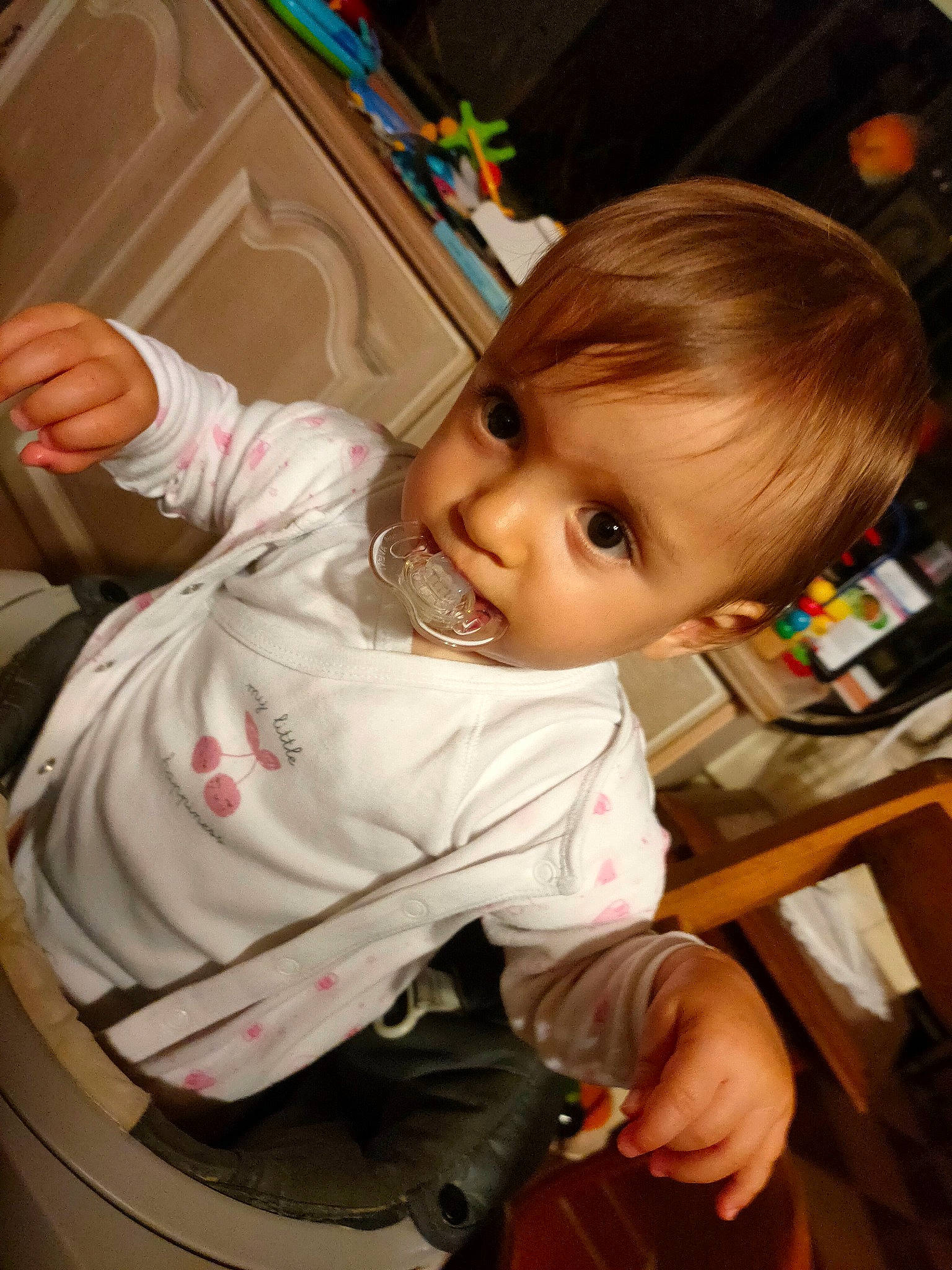 Nola participe au concours pour gagner de l'argent avec cette photo : arm, baby, baby_toddler_clothing, beauty, cheek, facial_expression, finger, flooring, fun, gesture, hairstyle, iris, mouth, nose, person, product, skin, sleeve, standing, toddler