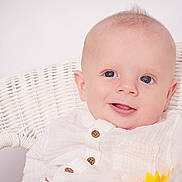 Riley joined the competition — help win amazing prizes! adorable, baby, baby_boy, blue_eyes, buttoned_shirt, child, closeup, cute, face, happy, indoors, infant, innocence, portrait, sitting, smile, soft_light, white_clothing, wicker_chair, young