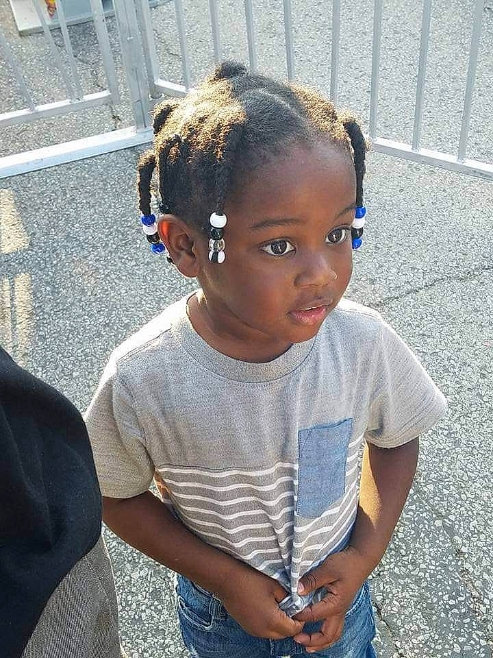 Jerry is registered to the contest to win money with this photo: audio_equipment, belt, black_hair, braid, child, cool, cornrows, denim, electric_blue, eyewear, fashion_accessory, hairstyle, happy, headphones, hearing, jewellery, person, sitting, sleeve, t_shirt