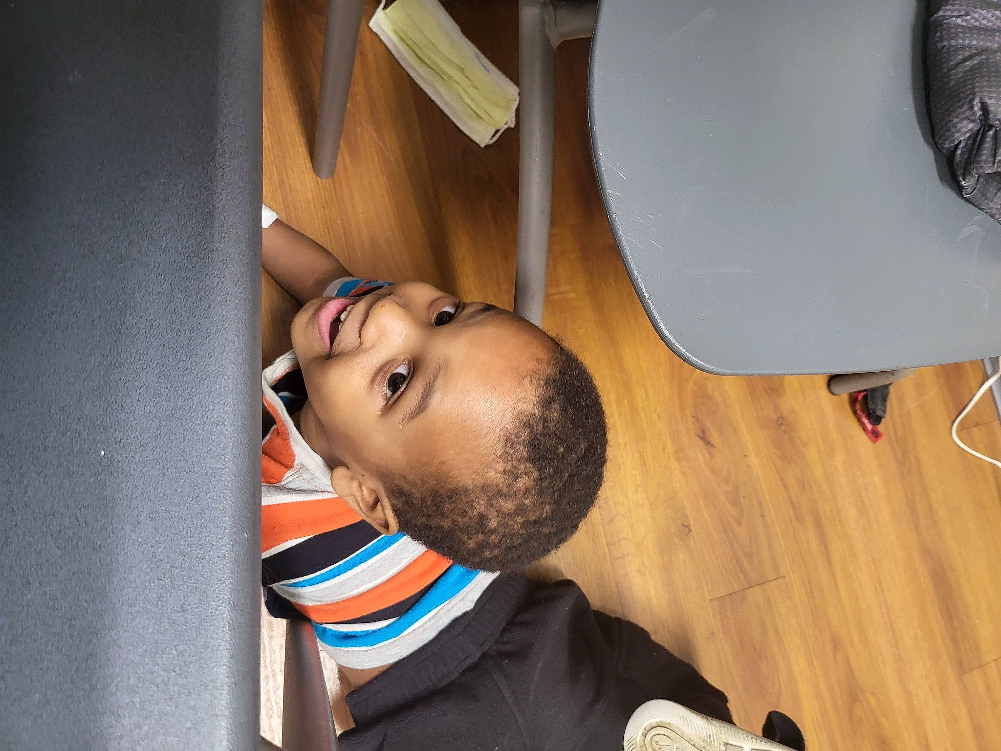 Jaxon joined the competition — help win amazing prizes! audio_equipment, beard, chair, child, circle, comfort, elbow, eyewear, flooring, fun, hardwood, mechanical_fan, person, plywood, room, t_shirt, table, varnish, wood, wood_flooring