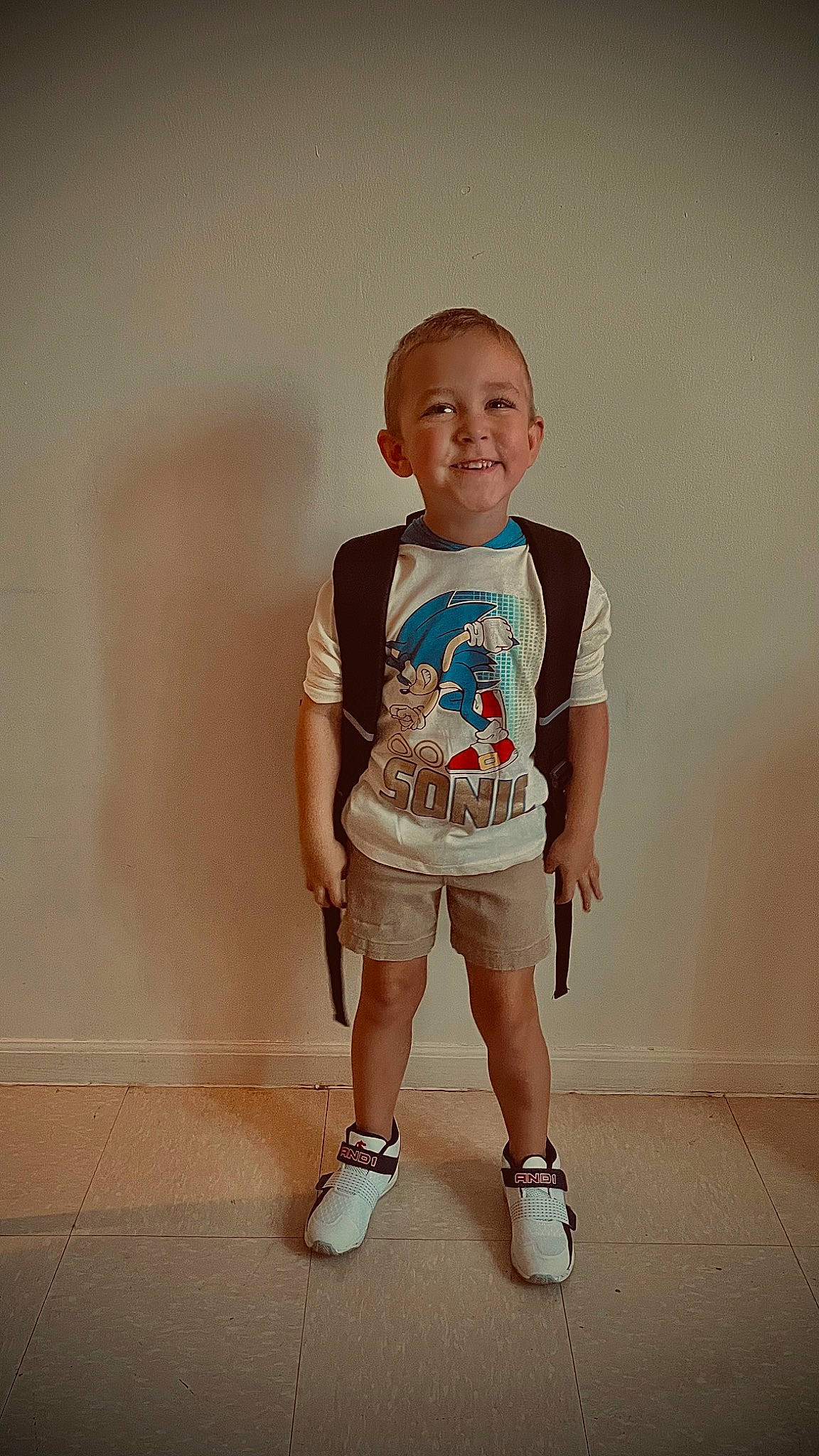 Kaiden joined the competition — help win amazing prizes! chest, child, fashion_design, flooring, fun, happy, human_leg, joy, knee, person, room, shorts, sleeve, smile, sportswear, standing, t_shirt, thigh, toddler, top