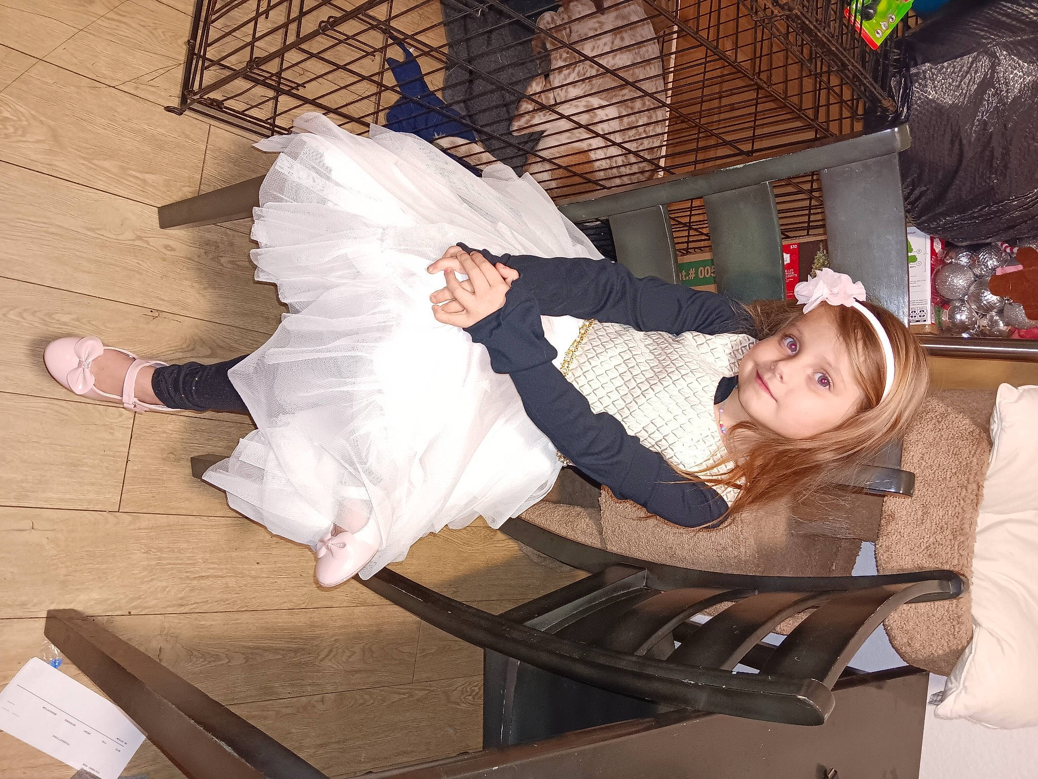 Addilynn is registered to the contest to win money with this photo: child, comfort, costume, event, fashion_design, formal_wear, fun, fur, happy, human_leg, lap, leisure, person, sitting, sleeve, smile, toddler, wood