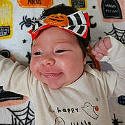 Aury is registered to the contest to win money with this photo: baby, infant, smiling, halloween, pumpkin, headband, cute, happy, ghost, costume, blanket, spider, web, magic, potion, face, child, clothing, celebration, festive