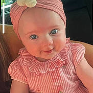Summer is registered to the contest to win money with this photo: baby, child, pink_dress, headband, seashells, blue_eyes, smile, portrait, indoor, car_seat, cute, infant, person, clothing, striped, flower_embroidery, skin, hand, seat, window