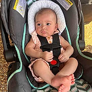 Dani is registered to the contest to win money with this photo: baby, car_seat, infant, child, safety_straps, cushion, pink_clothing, foot, hand, head_support, outdoor, seat, fabric, pattern, skin, person, cute, small, resting, comfortable