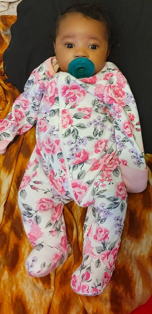 Emiliana joined the competition — help win amazing prizes! baby, baby_safety, baby_sleeping, baby_toddler_clothing, child, comfort, jacket, linens, military_camouflage, nose, orange, outerwear, pattern, person, pink, product, skin, sleeve, textile, toddler