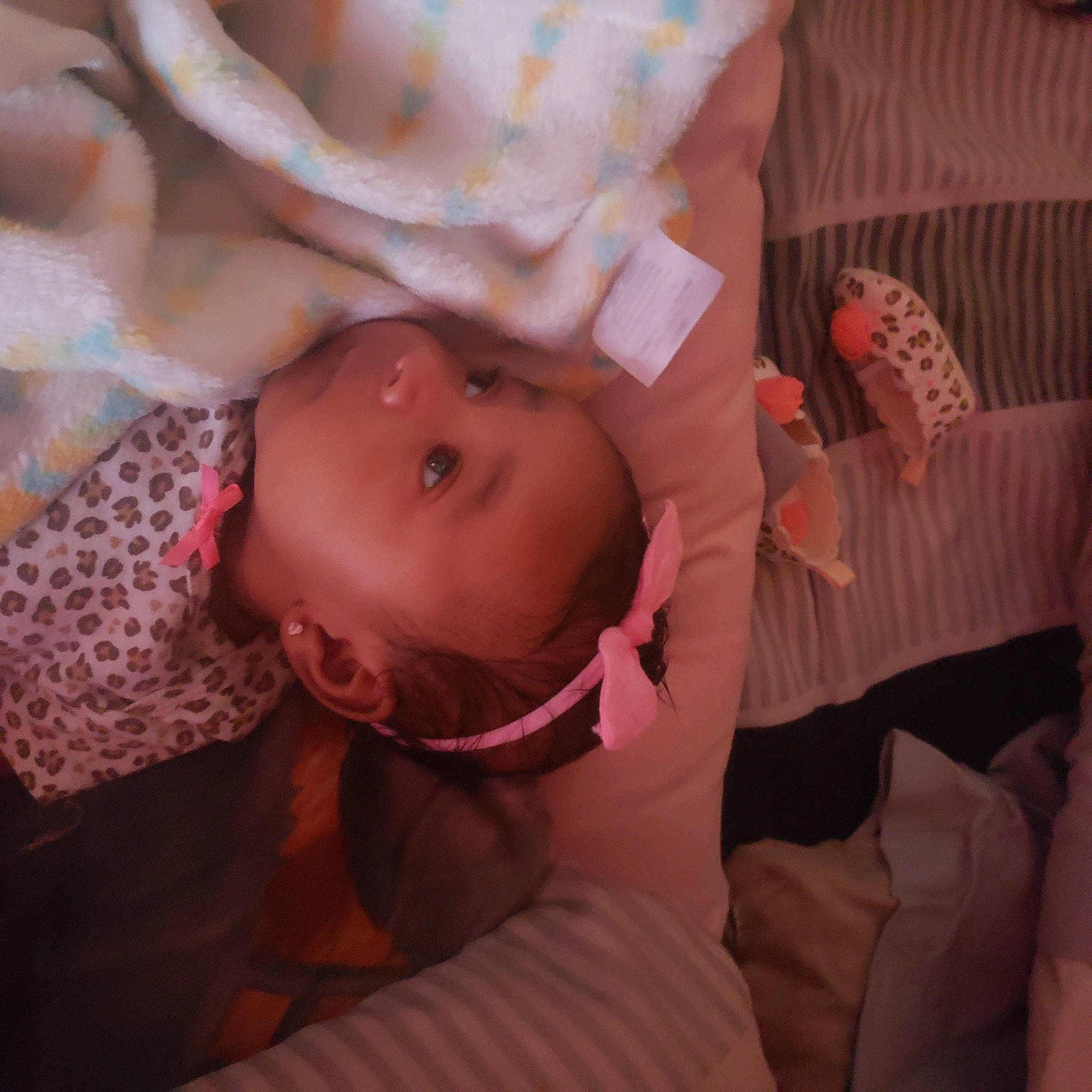 Emiliana is registered to the contest to win money with this photo: arm, baby_toddler_clothing, cheek, chin, comfort, eye, eyebrow, face, finger, hand, head, headgear, human_body, iris, lip, mouth, neck, nose, person, pink