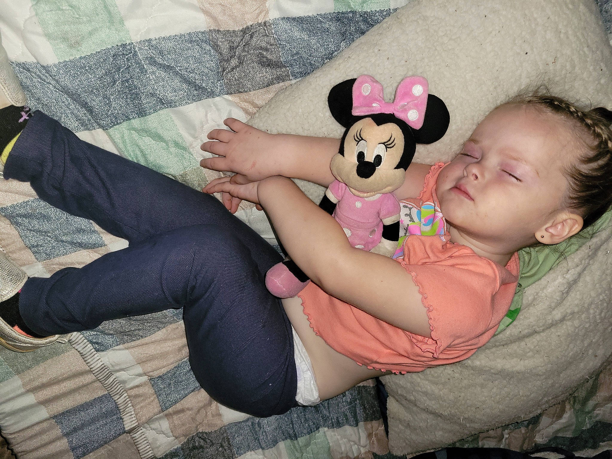 Olivia is registered to the contest to win money with this photo: baby_toddler_clothing, comfort, finger, foot, fun, grass, happy, human_leg, interaction, joint, knee, lap, person, pink, sitting, sock, stuffed_toy, teddy_bear, thigh, toddler