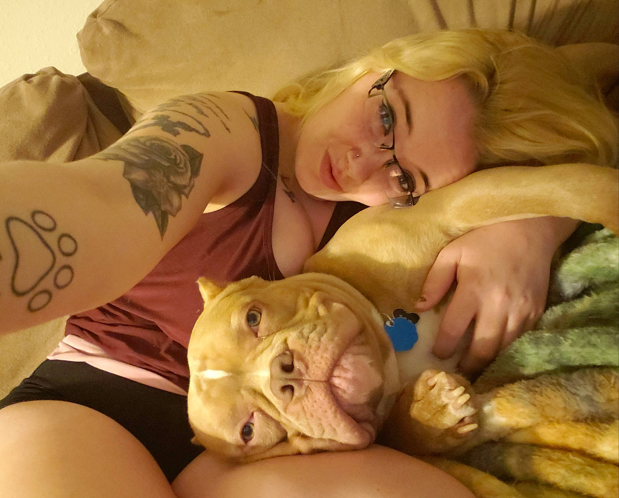 Capone is registered to the contest to win money with this photo: arm, comfort, eye, face, facial_expression, glasses, hand, head, human, human_body, joint, leg, mammal, mouth, muscle, neck, organ, skin, textile, vertebrate