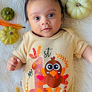 Evin joined the competition — help win amazing prizes! baby, infant, thanksgiving, onesie, turkey, gourds, autumn, fall, holiday, cute, smiling, face, person, lying_down, white_rug, decor, festive, child, happy, celebration