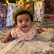 Diana joined the competition — help win amazing prizes! baby, carpet, celebration, cheerful, child, christmas_tree, crown, cute, decoration, festive, floor, gift_wrap, happy, holiday, indoors, infant, lights, present, smile, tinsel