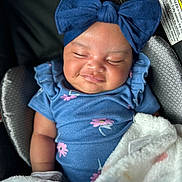 Diana is registered to the contest to win money with this photo: adorable, baby, blanket, blue_bow, blue_outfit, car_seat, child, closed_eyes, cozy, cute, flower_pattern, happy, headband, indoors, infant, portrait, sleeping, smile, soft_texture, young_child