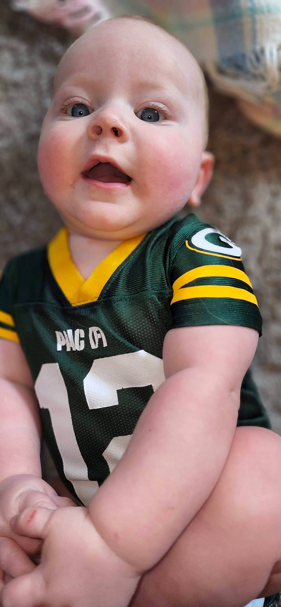 Ryder is registered to the contest to win money with this photo: baby_toddler_clothing, beauty, cheek, child, chin, eye, eyebrow, eyelash, grass, hair, happy, head, iris, lip, mouth, nose, organ, person, skin, sports_jersey