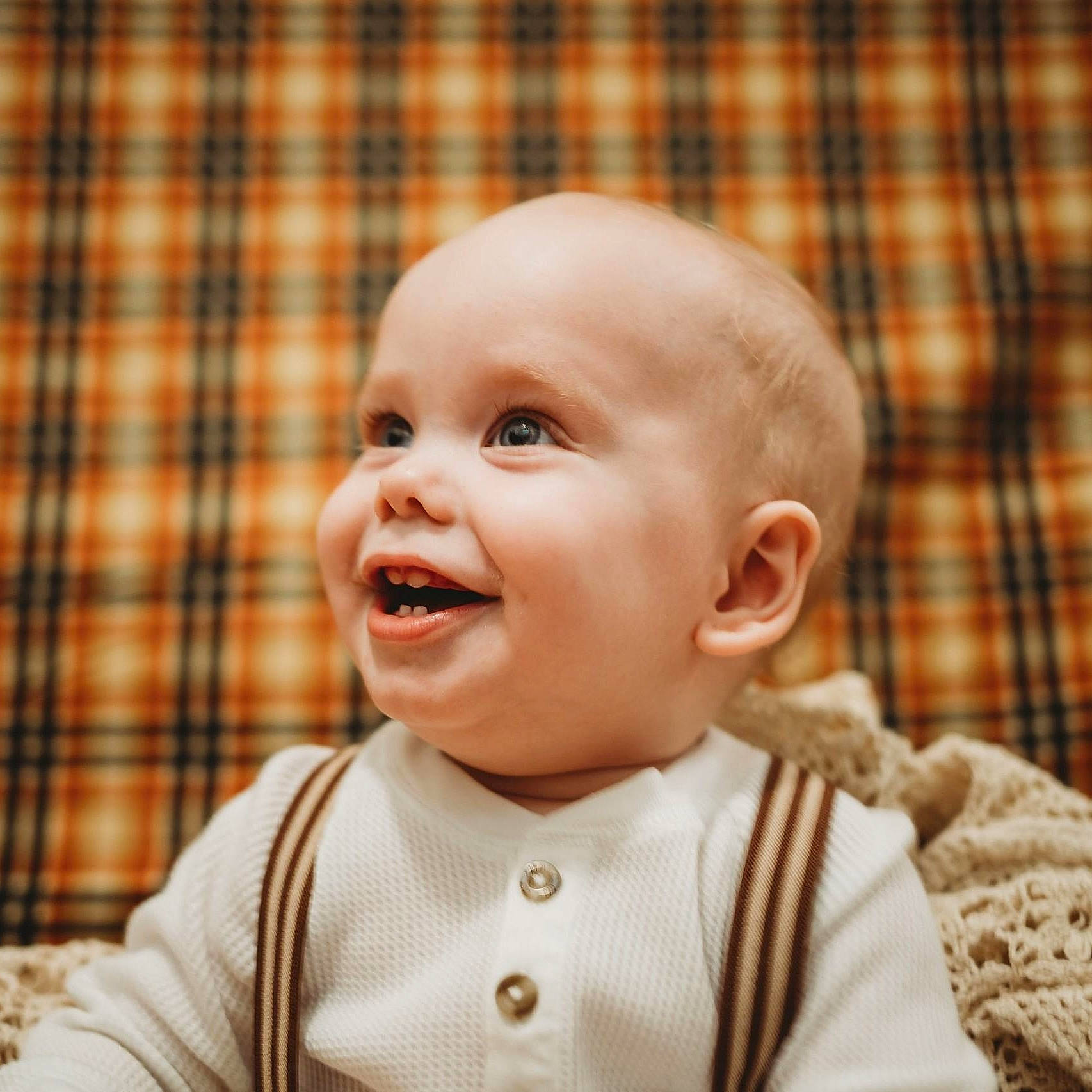 Spencer is registered to the contest to win money with this photo: baby, baby_laughing, baby_toddler_clothing, cheek, chin, collar, eyelash, happy, head, iris, lip, nose, pattern, person, plaid, skin, sleeve, smile, tartan, textile