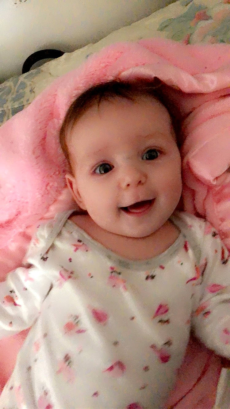 Addyson is registered to the contest to win money with this photo: baby, baby_toddler_clothing, cheek, chin, collar, eyebrow, face, facial_expression, happy, head, iris, lip, nose, outerwear, person, pink, skin, sleeve, smile, textile