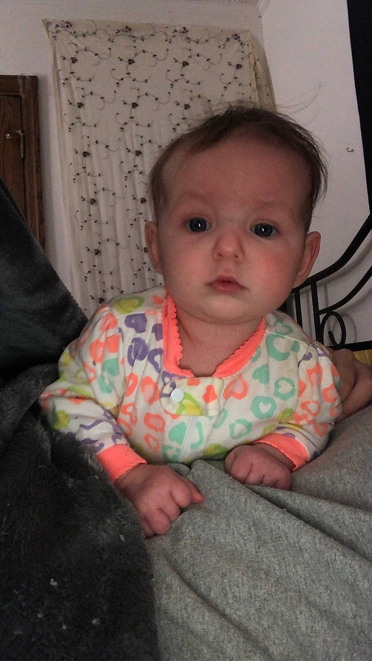 Addyson is registered to the contest to win money with this photo: baby, baby_toddler_clothing, cheek, chin, comfort, eye, eyebrow, flooring, forehead, fun, head, iris, linens, lip, mouth, nose, person, skin, sleeve, textile